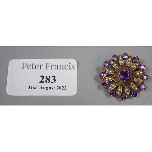 283 - A Victorian circle brooch set with amethyst and seed pearls.  Diameter approx 27mm.  Approx weight 5... 