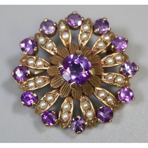 283 - A Victorian circle brooch set with amethyst and seed pearls.  Diameter approx 27mm.  Approx weight 5... 