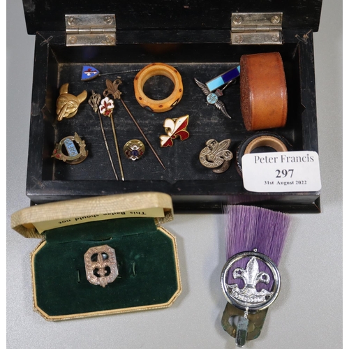 297 - Ebonised box containing assorted Boy Scouts items, including: pin badges, cap badge, lapel badges, w... 