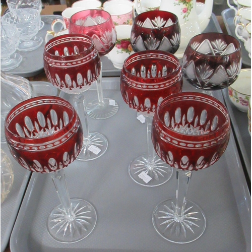 359 - Seven coloured flash cut glass hock glasses with star cut bases; four with cranberry glass and Water... 