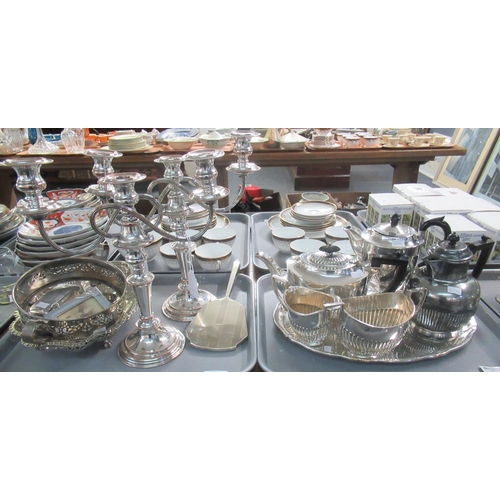 374 - Four trays of assorted metalware mostly silver plate to include; three piece teaset, coffee pots, va... 