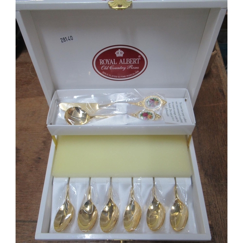 383 - Boxed set of Royal Albert 'Old Country Roses' gold plated and fine porcelain teaspoons, butter knife... 