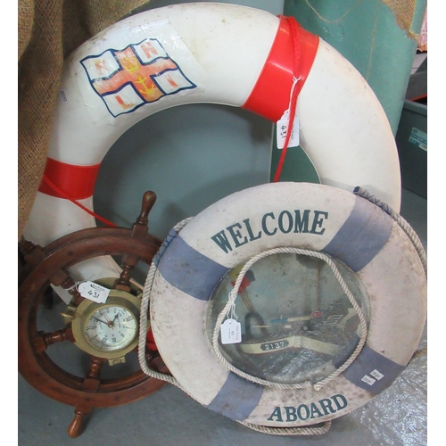 431 - Ship's wheel with quartz clock to the centre together with an RLNI lifebelt and a decorative lifebel... 