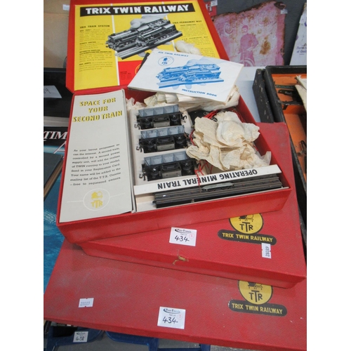 434 - Three boxes of vintage Trix Twin Railway engines, carriages, tracks and accessories, including the o... 