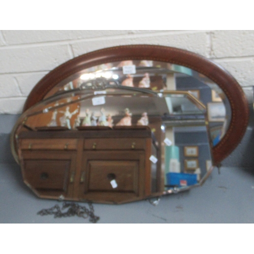 442 - Mahogany framed oval mirror with banded decoration, together with an oval mirror with Art Nouveau  d... 