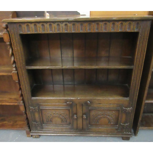 471 - Reproduction 17th century style oak book case with two shelves and two arch moulded cupboards below.... 