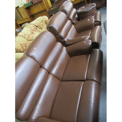 502 - Modern brown leather three piece suite comprising two seater sofa and a pair of armchairs together w... 