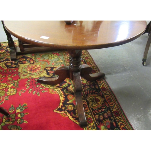 516 - 19th century mahogany pedestal snap top dining table with baluster turned pillar on tri form base.  ... 