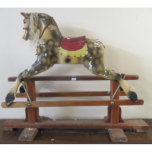 529 - Early 20th century child's rocking horse, with painted features on a patent swing stand.  (B.P. 21% ... 