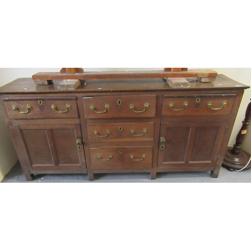 530 - Early 19th century North Wales oak dresser base having three frieze drawers above two blind panelled... 