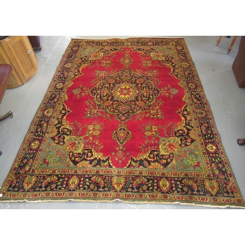 542 - Large red ground middle eastern carpet.  399x289cm approx.  (B.P. 21% + VAT)