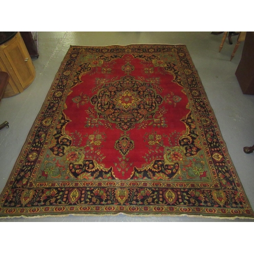 542 - Large red ground middle eastern carpet.  399x289cm approx.  (B.P. 21% + VAT)