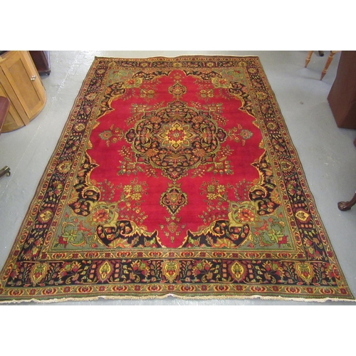 542 - Large red ground middle eastern carpet.  399x289cm approx.  (B.P. 21% + VAT)