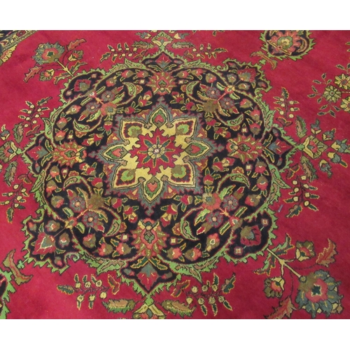 542 - Large red ground middle eastern carpet.  399x289cm approx.  (B.P. 21% + VAT)