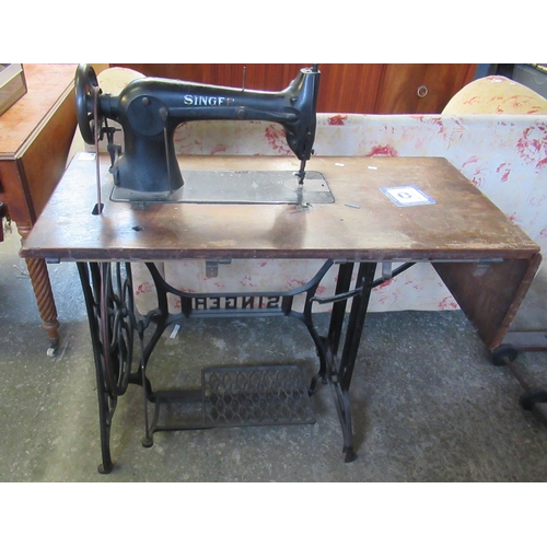 549 - Early 20th century Singer sewing machine on oak stand with cast iron Singer base.  (B.P. 21% + VAT)