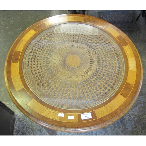 557 - Modern walnut cross banded circular coffee table with glazed cane work panel, 61cm diameter approx. ... 