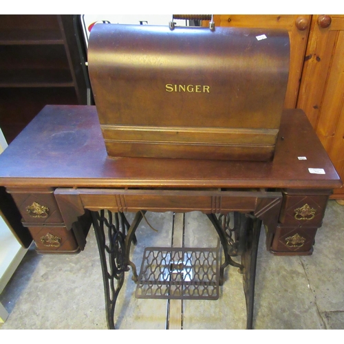 572 - Singer Sewing Machine in bentwood case together with a cast iron sewing machine stand with treadle b... 