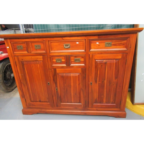 580 - Modern acacia wood sideboard or cabinet with four drawers and three shelved cupboards. Recessed bras... 