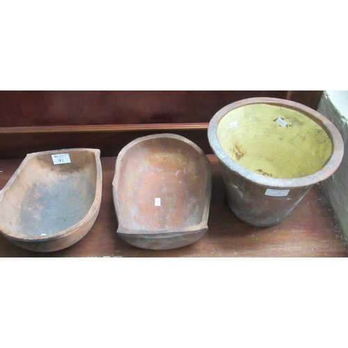 71 - Two Habitat terracotta pottery niche shaped planters, together with a small Welsh pottery crochan or... 