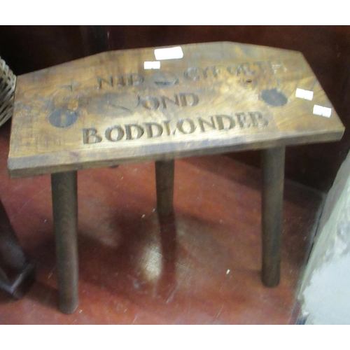 72 - Modern Welsh oak three leg milking stool with carved text 'Nid Cyfoeth Ond Boddlondeb', (