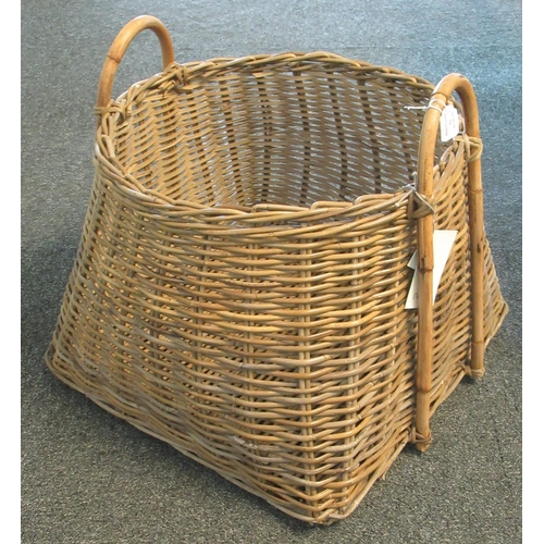 73 - Large wicker or rattan two handled log basket bearing 'Nkuku' trade label.  (B.P. 21% + VAT)