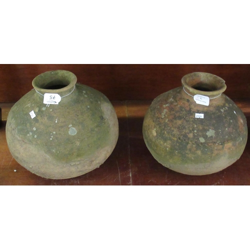 75 - Two terracotta pottery globular jars.  32cm diameter approx.  (B.P. 21% + VAT)