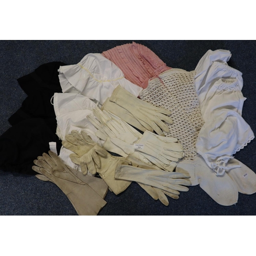 214 - Box containing various antique fashion accessories to include; suede gloves, cotton bonnets, knitted... 