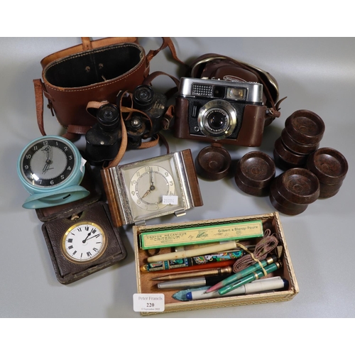 220 - Box of oddments to include; 8 day Swiss made travelling alarm clock in leather case, vintage Voigtla... 