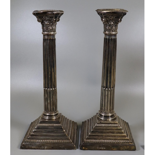 227 - Pair of silver Corinthian column candlesticks on square stepped beaded bases, Birmingham hallmarks. ... 