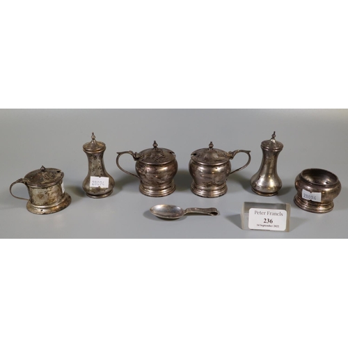 236 - Collection of silver condiments; mustard pots, pepperettes and caddy spoon. 7.6 troy ozs approx. 
(B... 