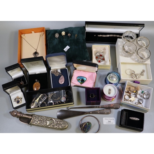 242 - Box of assorted silver and other items to include; tie pins, brooches, button hooks with silver hand... 