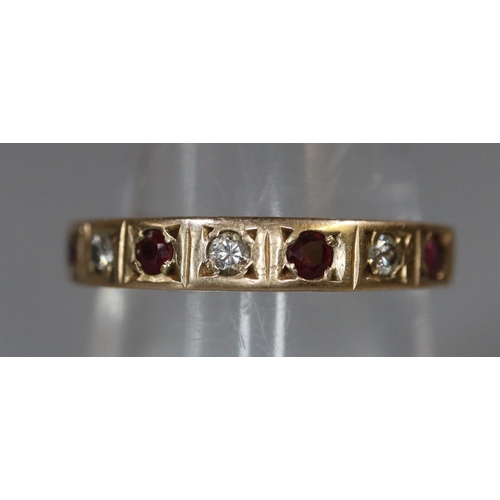 243 - 9ct gold diamond and ruby half hoop eternity ring. 2.1g approx, size N + 1/2.
(B.P. 21% + VAT)