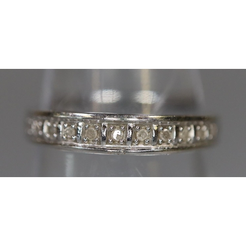 251 - 9ct white gold diamond set half hoop eternity ring. 1.4g approx, size L.
(B.P. 21% + VAT)