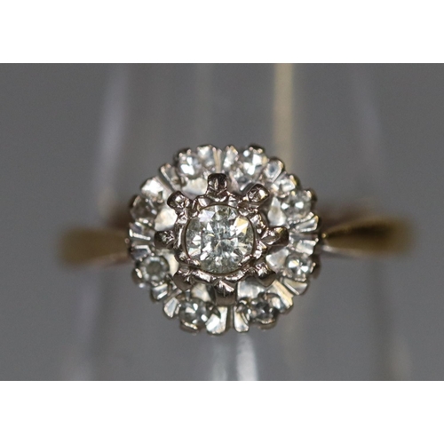 255 - 18ct gold diamond cluster flowerhead design ring. 2.9g approx, size K + 1/2. Boxed.
(B.P. 21% + VAT)