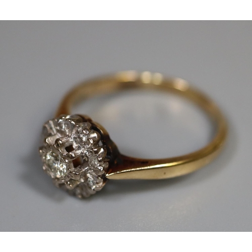 255 - 18ct gold diamond cluster flowerhead design ring. 2.9g approx, size K + 1/2. Boxed.
(B.P. 21% + VAT)