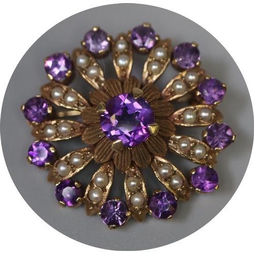 265 - A Victorian circle brooch set with amethyst and seed pearls.  Diameter approx 27mm.  Approx weight 5... 