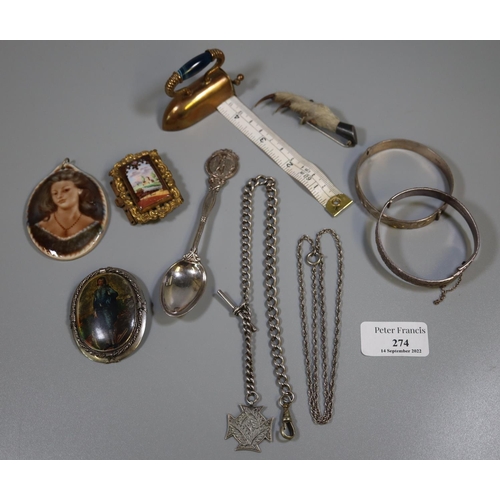 274 - Collection of assorted metalware items; brass flat iron shaped tape measure, pin brooches, porcelain... 