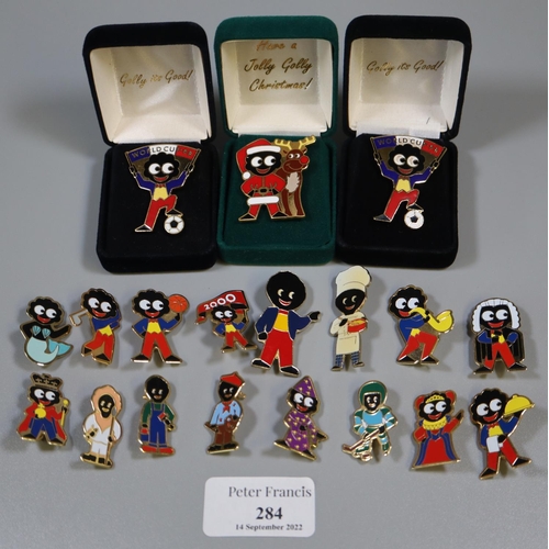 284 - Box of assorted metal Golly pin badges, including; World Cup '98.
(B.P. 21% + VAT)