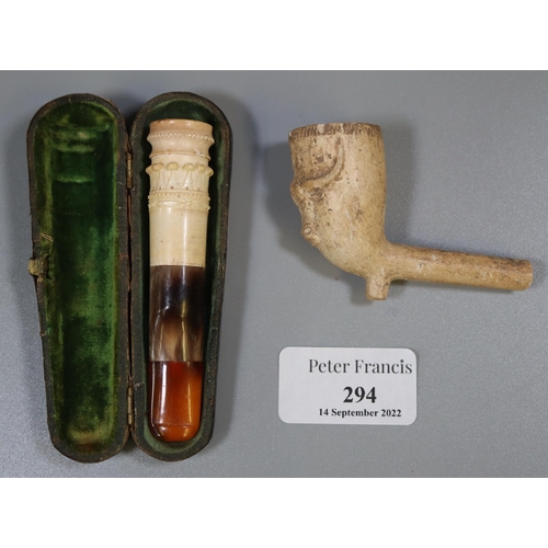 294 - Meerschaum amber cheroot holder in leather case, together with a clay pipe with bull's head. 
(B.P. ... 