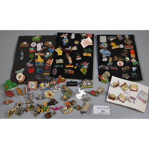 302 - Box of assorted enamel and other badges to include: 'Total', Pudsey bear, Loto etc. 
(B.P. 21% + VAT... 