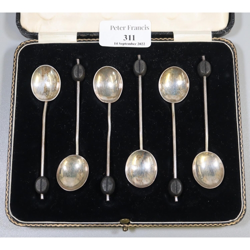 311 - Cased set of six silver coffee bean spoons. 1.2 troy ozs approx. 
(B.P. 21% + VAT)