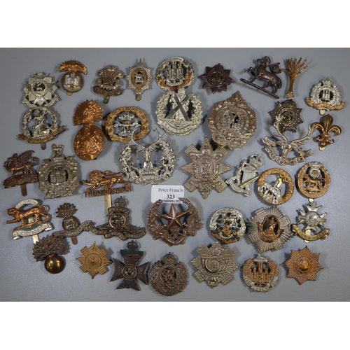 323 - Biscuit tin containing a large collection of British military cap badges, various.
(B.P. 21% + VAT)