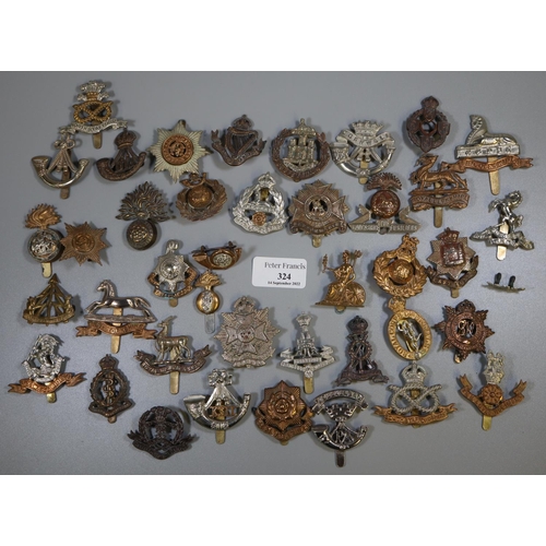 324 - Bag containing a good selection of British military cap badges.
(B.P. 21% + VAT)