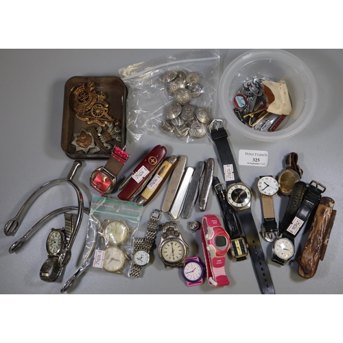 325 - Collection of assorted military badges, wristwatches, pocket knives, spurs etc. 
(B.P. 21% + VAT)