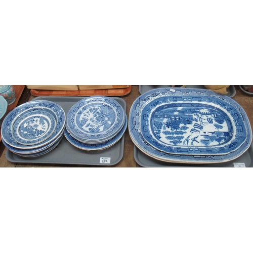 387 - Two trays comprising 19th Century blue and white 'Willow' transfer printed oval meat dishes and simi... 