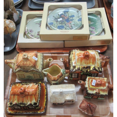 408 - Three Heinrich fairy collectors plates in original boxes, together with a tray of assorted cottage w... 