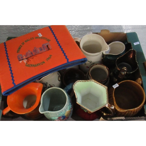 411 - Box of assorted dresser jugs, together with a Prince of Wales Investiture Caernarfon 1969 tea cosy. ... 