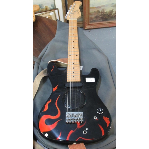 418 - Music Alley kid's starter six string electric guitar with flame design, in canvas slip.
(B.P. 21% + ... 