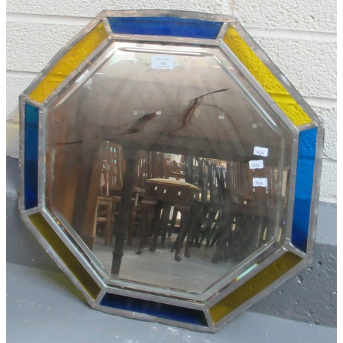 424 - Stained glass and lead framed octagonal wall mirror. 
(B.P. 21% + VAT)