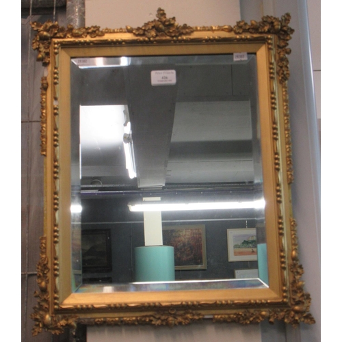 426 - Good quality ornately carved bevel plate gilt framed mirror with moulded leaf and acorn decoration. ... 